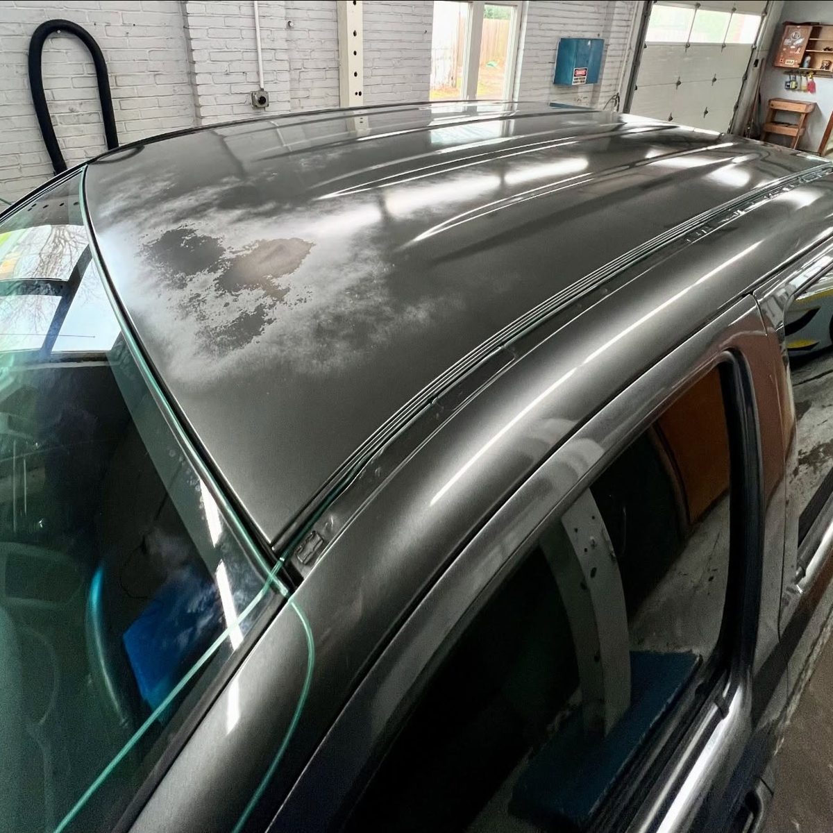 Faded, peeling Toyota Tacoma roof before wrap